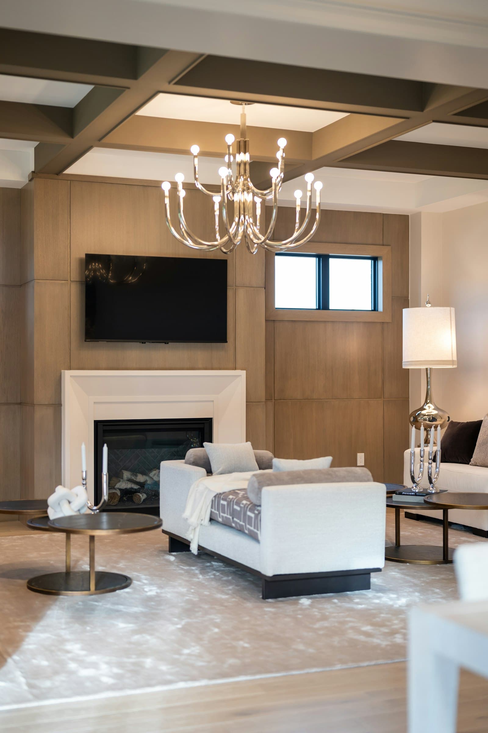 TV mounted in an elegant living room with a fireplace