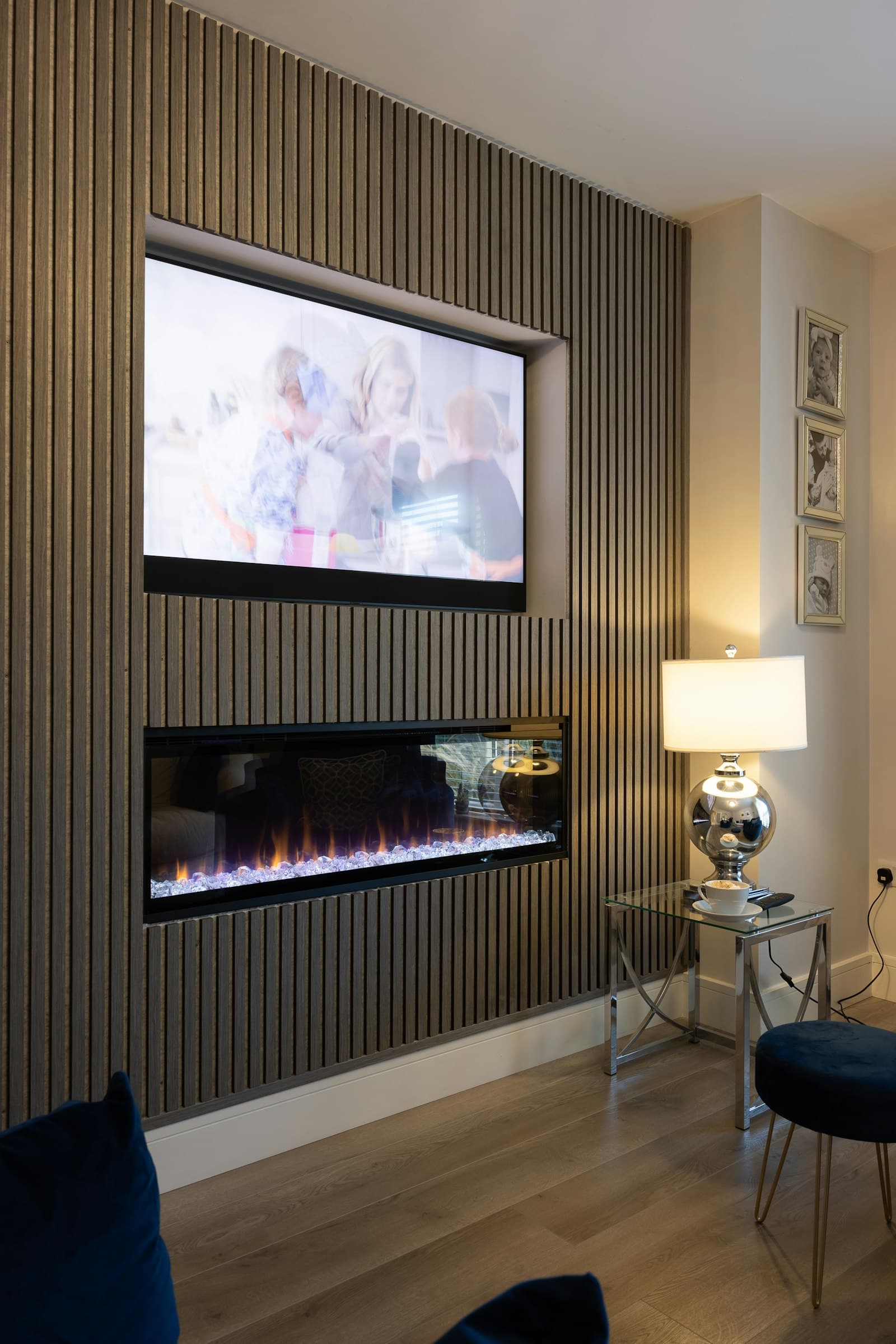 TV mounted above a modern fireplace in a living room